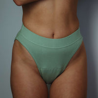 Green high-leg period underwear by Simplechicks offering comfort and eco-friendly protection.