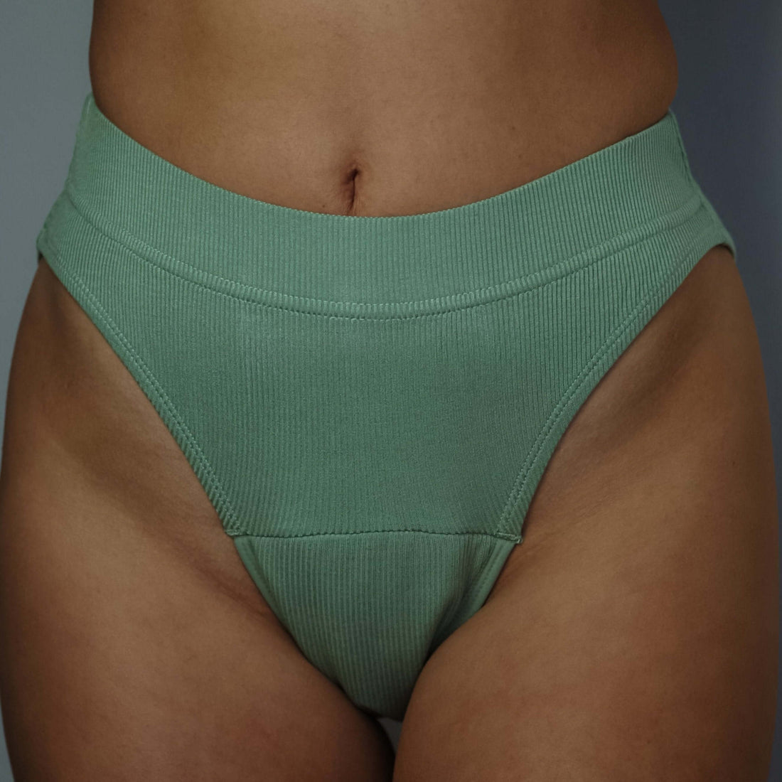 High-leg green period underwear by Simplechicks providing eco-friendly comfort and reliable absorption.