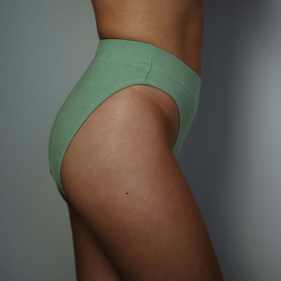 Simplechicks' Period Underwear in green, featuring a high-leg style for comfort and eco-friendly, sustainable period protection.